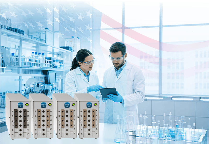 hero US transparent 800px Scientists in laboratory with degassers.